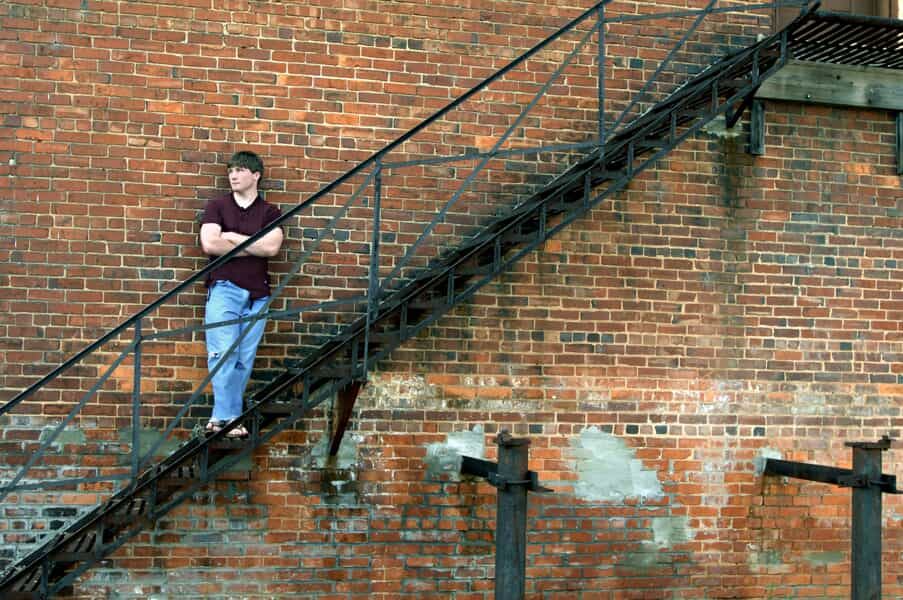 Teenager Leaning Against a Wall